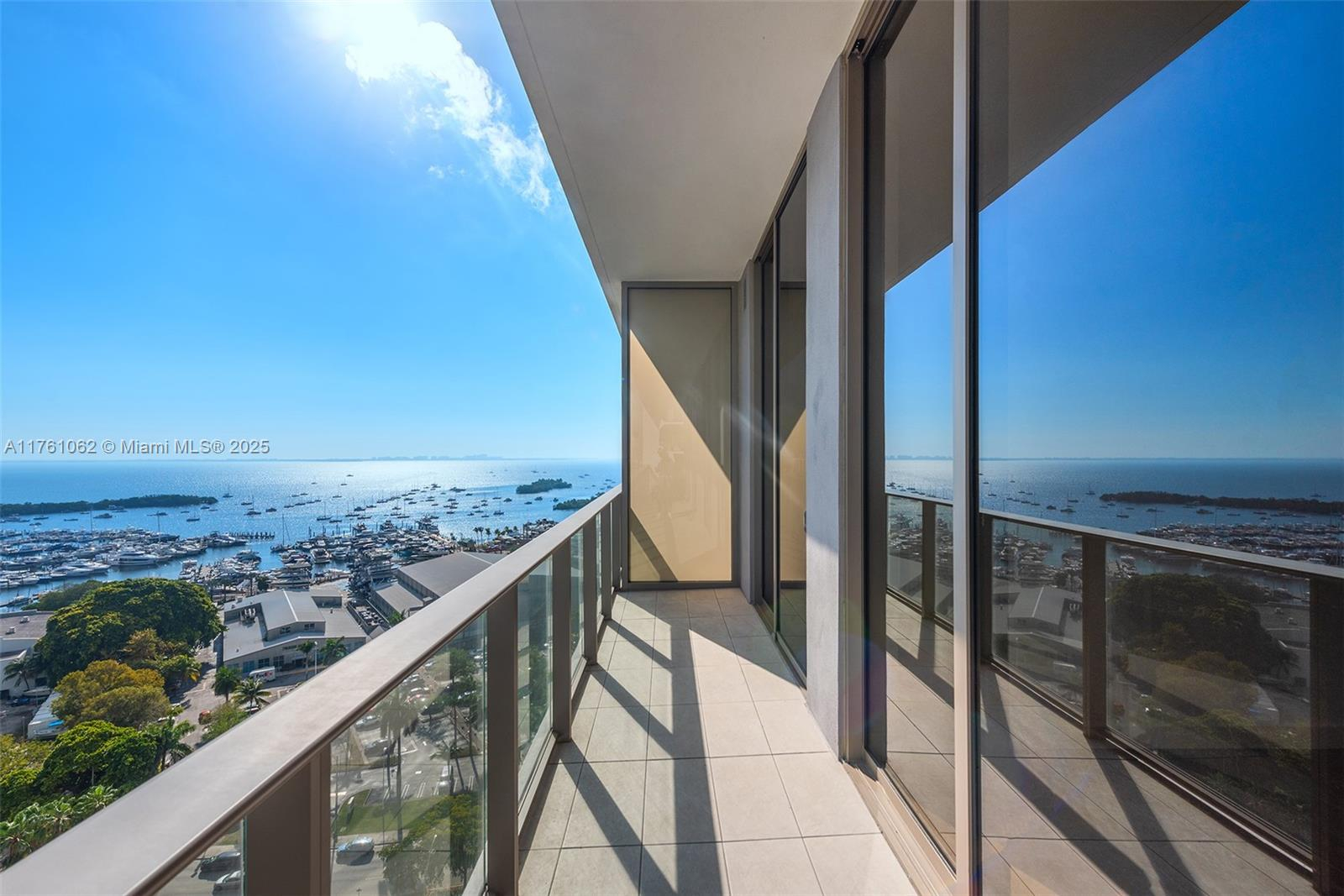 Luxury Miami condominium terrace with panoramic waterfront and skyline views